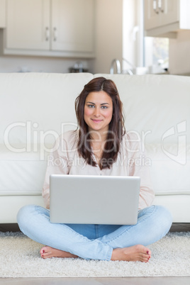 Woman typing on laptop