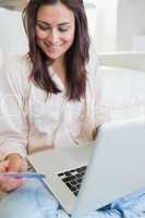 Woman happily shopping online