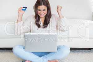 Happy woman buying something online