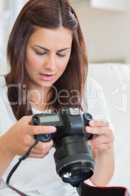Woman viewing pictures on the camera