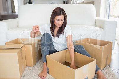 Woman looking into moving boxes