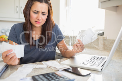 Young woman getting stressed over finances