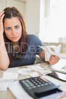 Young woman feeling financial pressure