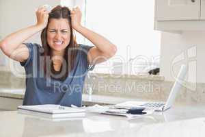 Woman getting frustrated over bills