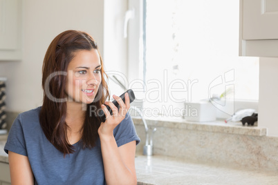 Brunette calling with her smartphone