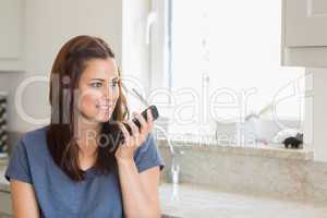 Brunette calling with her smartphone