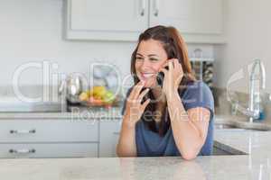 Brunette woman smiling and calling