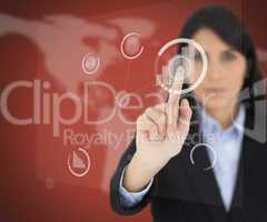 Businesswoman touching one button on red screen