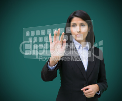 Businesswoman touching projected digital keyboard