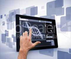 Man pointing at DNA interface on digital tablet