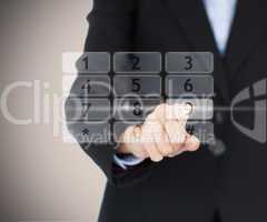 Business woman entering code on digital number pad