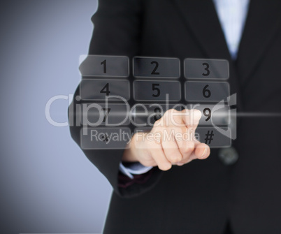 Business woman entering pin on digital number pad