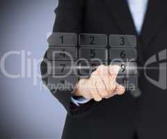 Business woman entering pin on digital number pad