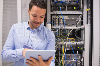 Data centre worker with tablet computer