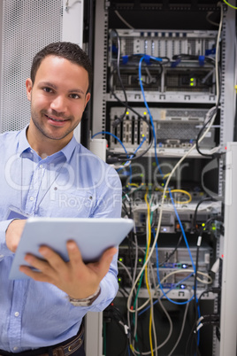 Man with tablet pc in data centre