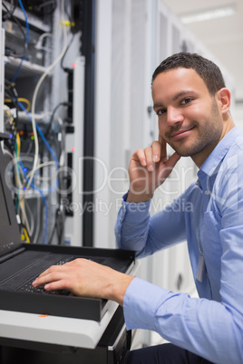 Happy man working with servers