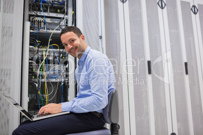 Smiling man working on the servers