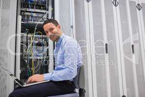 Smiling man working on the servers