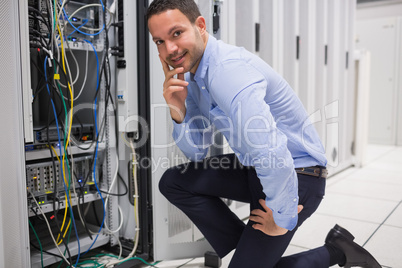Smiling man checking the servers