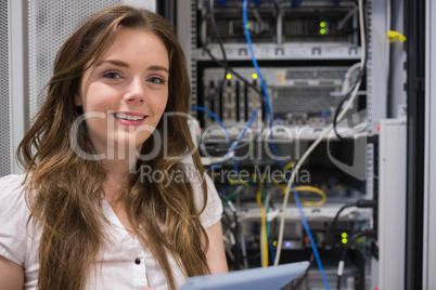 Smiling woman standing in front of servers
