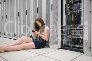 Woman texting next to the servers