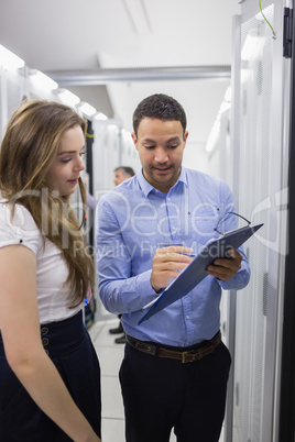 Technicians talking in data center