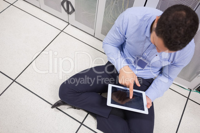 Man with tablet pc in data center