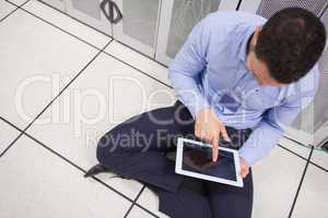 Man with tablet pc in data center