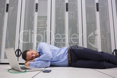 Man sleeping while doing maintenance on servers