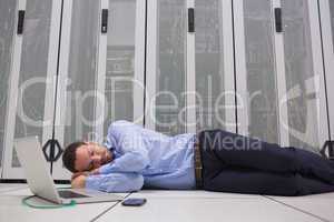Man sleeping while doing maintenance on servers