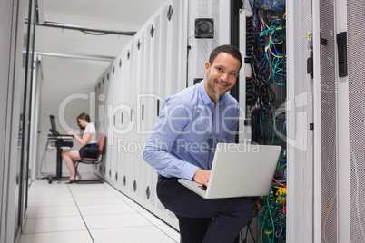 Two technicians doing data storage
