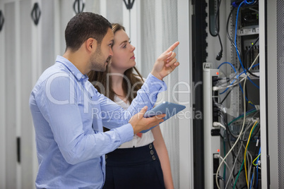 Technicians looking at servers