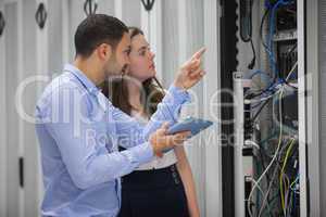 Technicians looking at servers