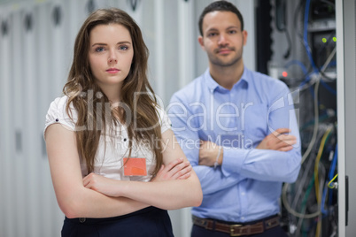 Man and woman standing in data center