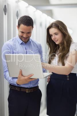 Technicians working on laptop