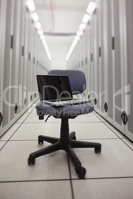 Laptop on a chair in hallway