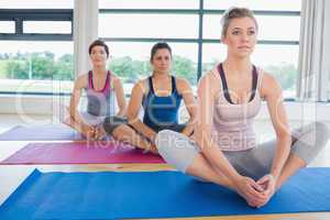 Women sitting in bound angle yoga pose