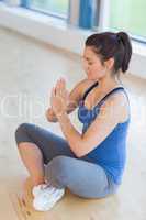 Woman meditating in easy yoga pose