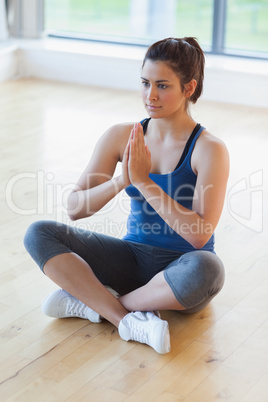 Woman sitting in easy yoga pose