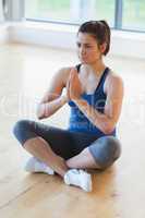 Woman sitting in easy yoga pose