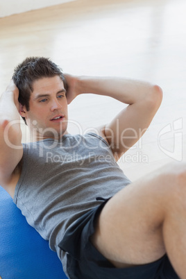 Man doing sit ups at the gym