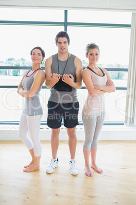 Smiling trainer with women