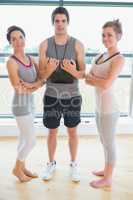 People standing at the gym smiling