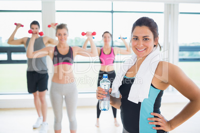 Woman at front of aerobics class