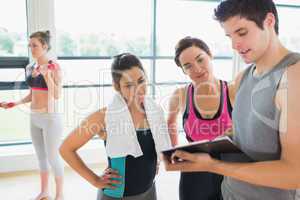Trainer and women talking