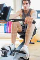 Man rowing at the row machine