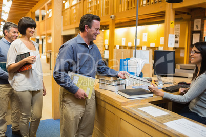 Man taking out a book