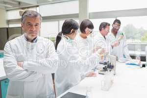 Chemist in busy lab