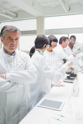 Chemist standing in front of tablet pc