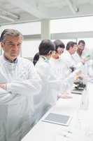 Chemist standing in front of tablet pc